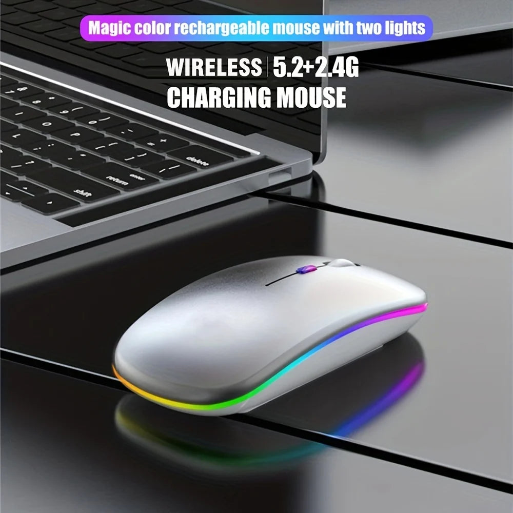 Slim, silver wireless rechargeable mouse with vibrant LED light trim and dual connectivity, placed next to a laptop.