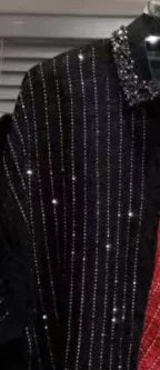 Black shirt with vertical rhinestone pinstripes and a heavily embellished, sparkling jewelled collar.