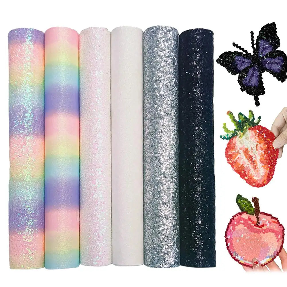 Six rolls of multi-coloured glitter fabric sheets, including rainbow and metallic finishes, plus three craft cutouts.