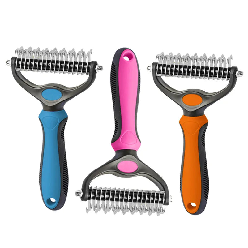 Three dog grooming dematting rakes with blue, pink, and orange handles against a white background.