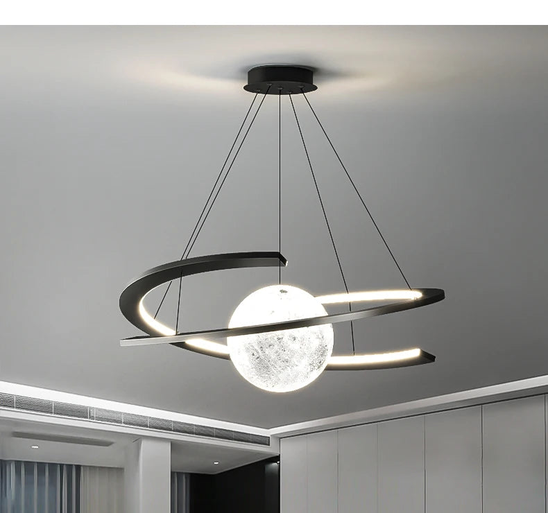 Modern black pendant light with a textured glass moon-style globe and an encircling LED ring frame.