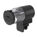 Black automatic fish tank feeder with a clear food storage drum and adjustable mounting clamp.