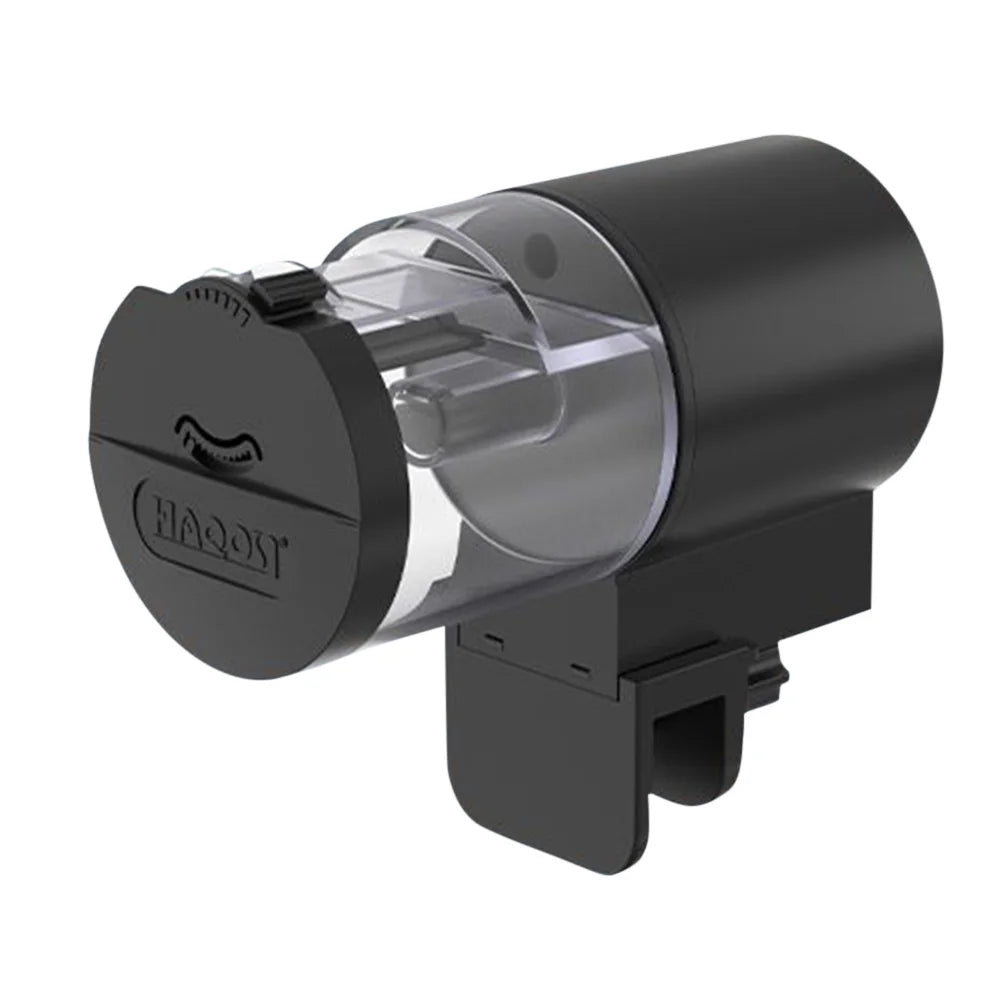 Black automatic fish tank feeder with a clear food storage drum and adjustable mounting clamp.