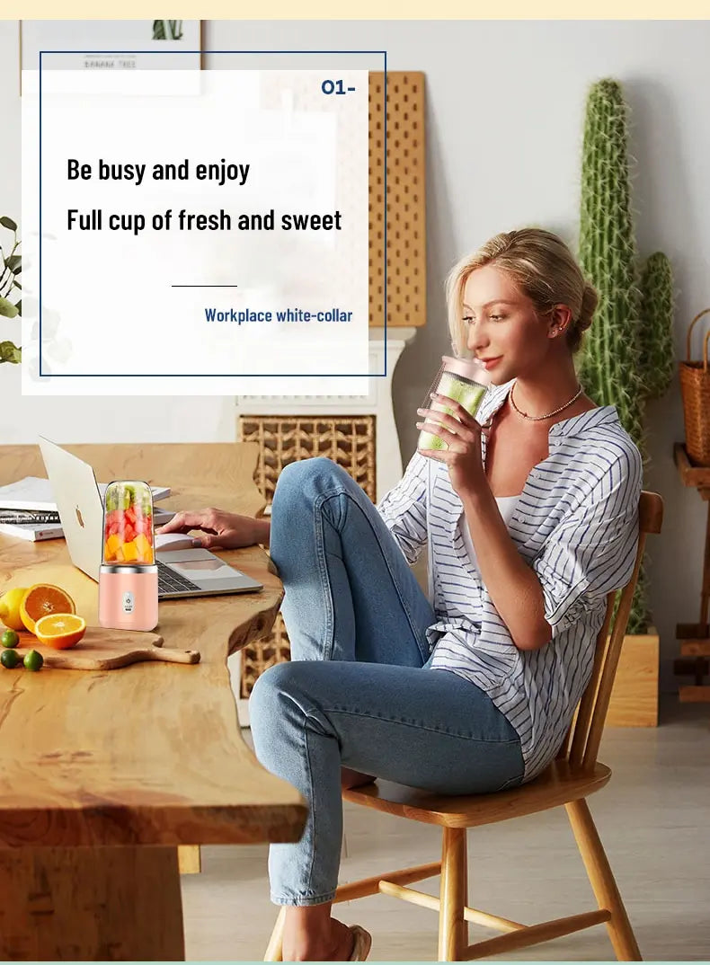 A woman drinks from a portable, rose-gold personal blender at a desk. The blender is sleek, compact, and modern.