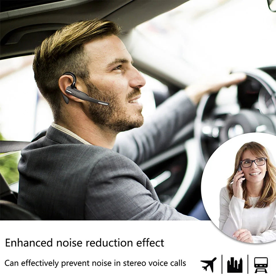 A man driving while wearing a sleek black, over-ear wireless Bluetooth headset with a microphone boom arm.