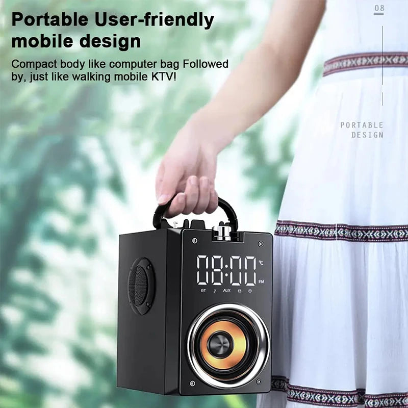 A compact black portable speaker with a top carry handle, digital clock display, and a prominent front speaker driver.