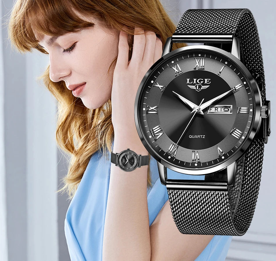 Elegant black stainless steel women’s watch with a mesh strap, dark sunray dial, and Roman numeral hour markers.