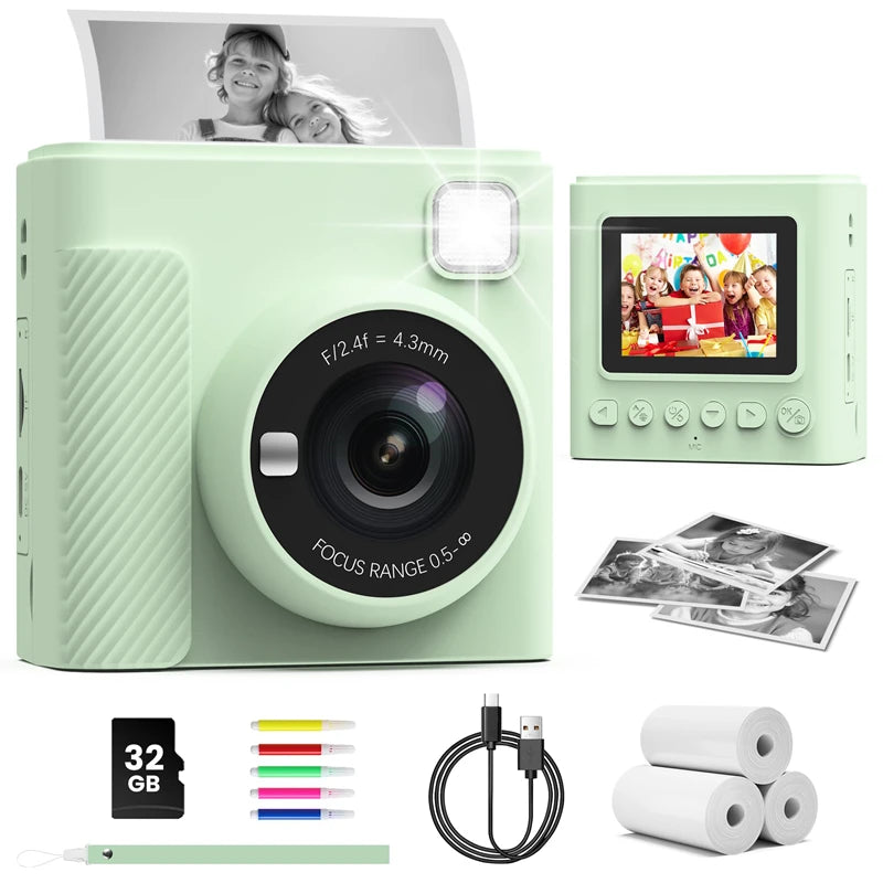 Light green plastic digital instant print camera with screen, flash, 32GB SD card, markers, cable, and paper rolls.