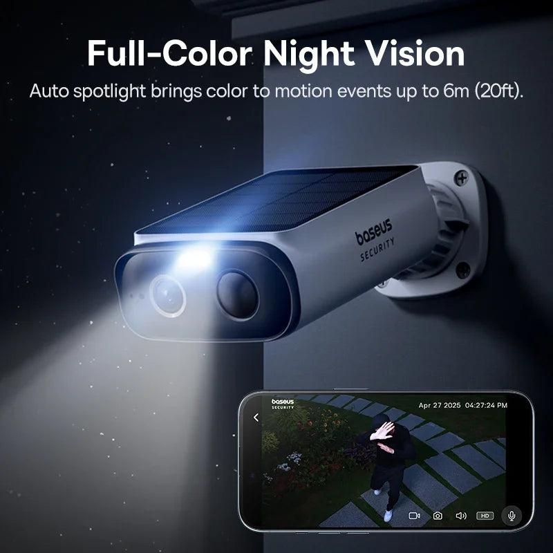 A Baseus security camera mounted outdoors at night, with an illuminated spotlight and smartphone displaying a color feed.