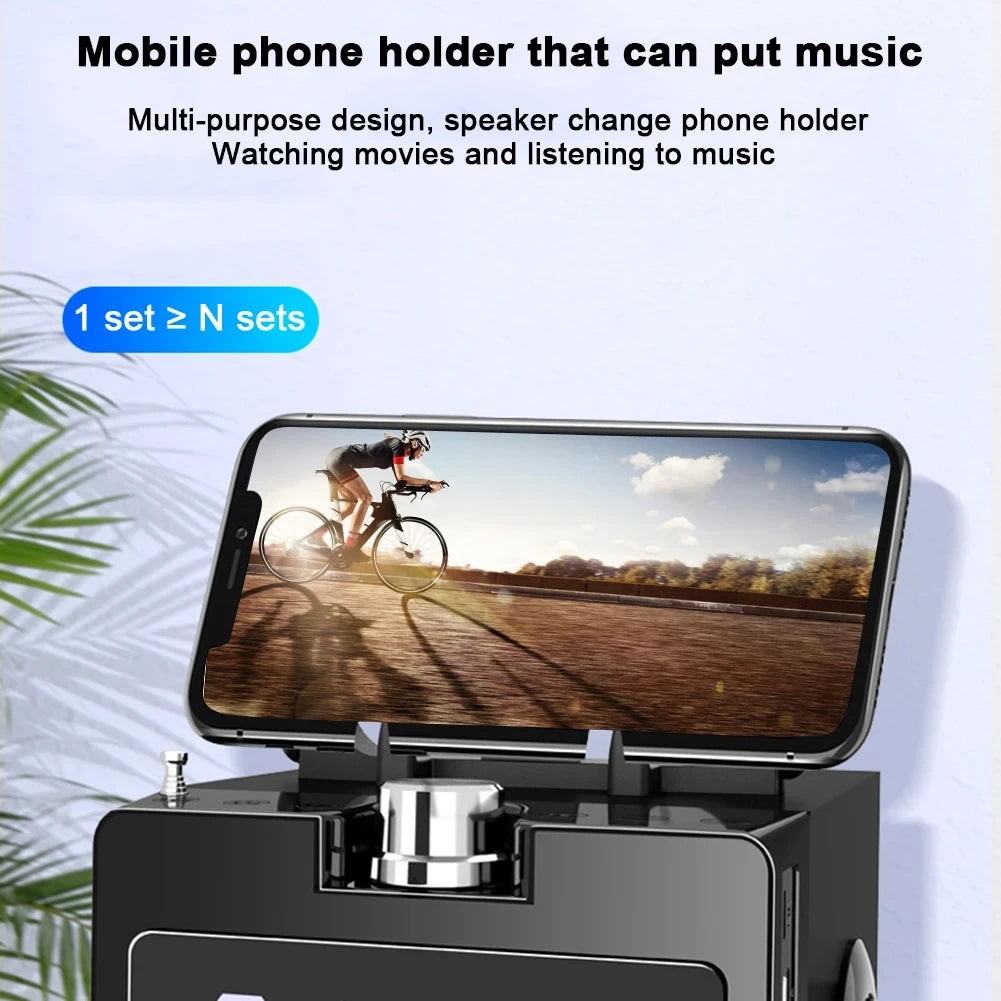 Portable black wooden Bluetooth speaker featuring a built-in mobile phone holder for media viewing.