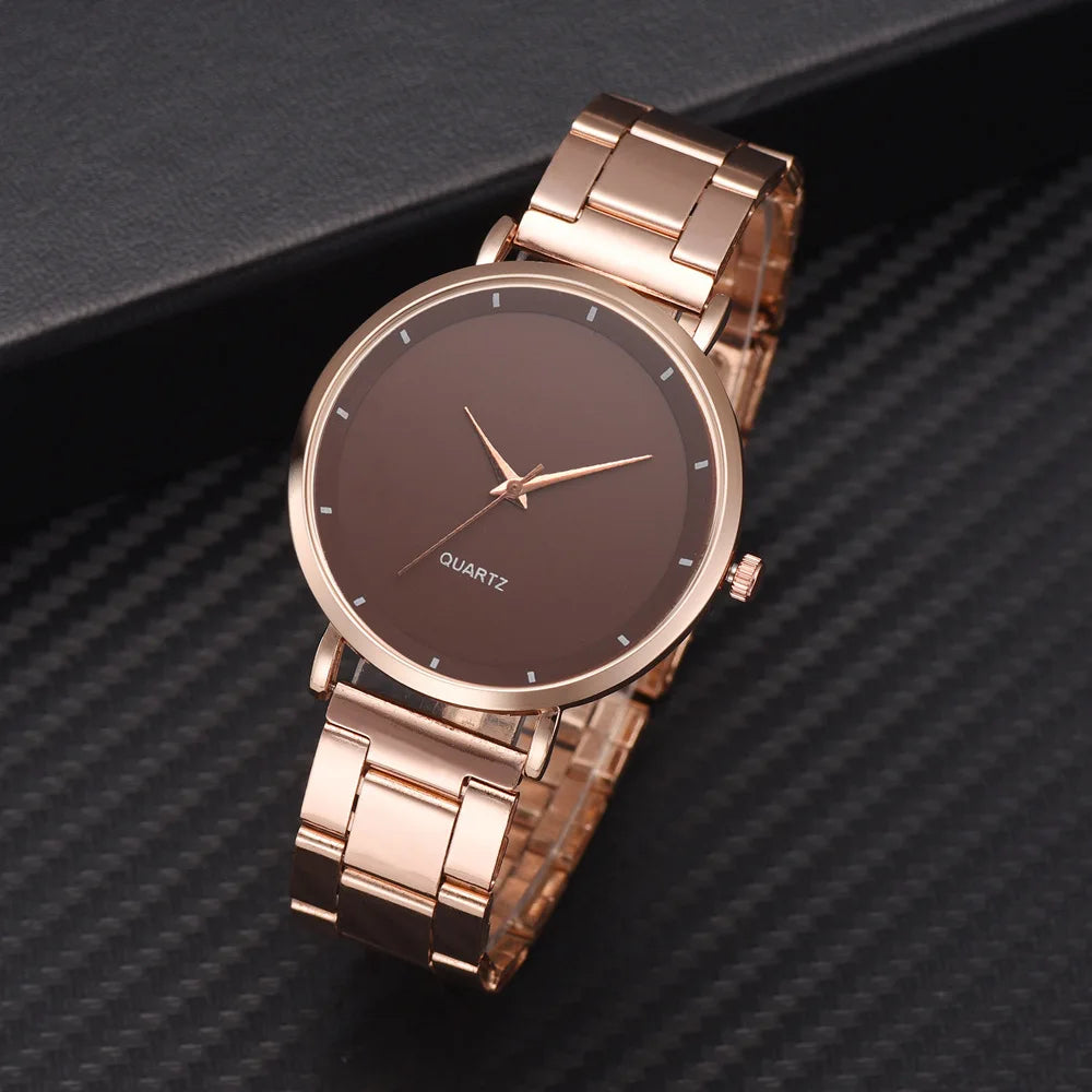 Elegant ladies' rose gold stainless steel watch with a minimalist brown dial and matching link bracelet.