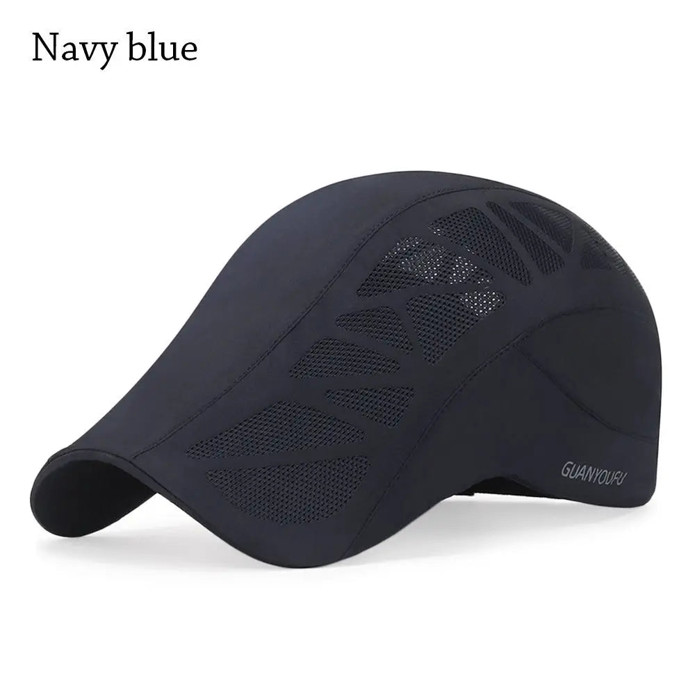 Navy blue men's flat cap with a structured peak and breathable mesh panel detailing.