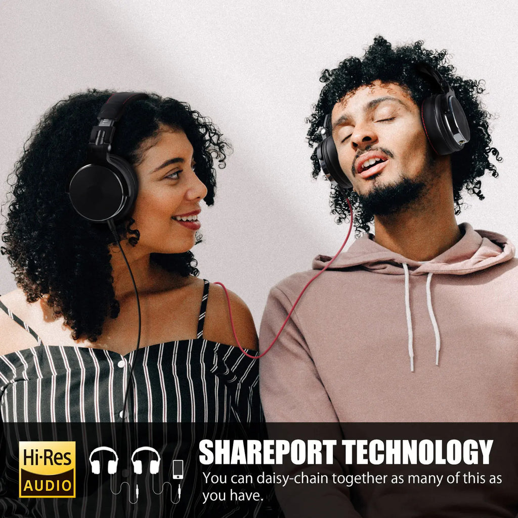 Two people wearing black, over-ear wired studio headphones connected together via a cable for shared audio listening.