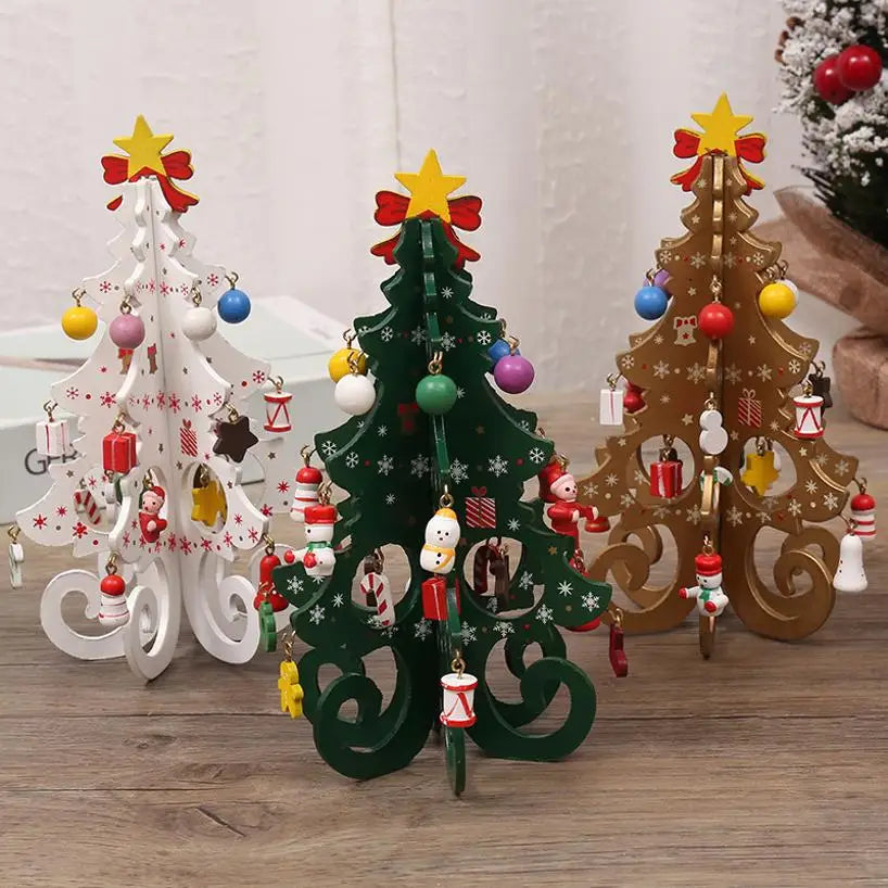 Three decorative wooden Christmas tree ornaments in white, green, and gold, featuring hanging baubles and festive icons.