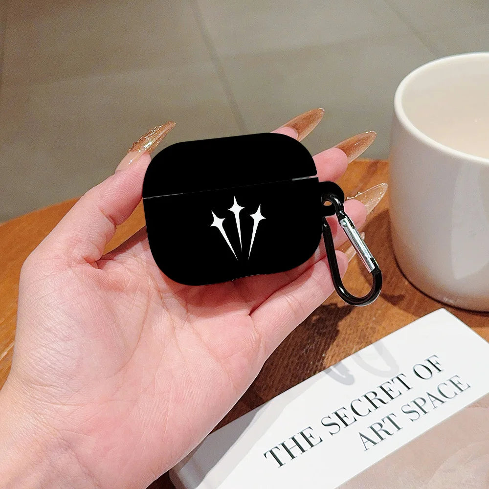 Black silicone AirPods Pro case featuring a white star design and a matching black carabiner clip.