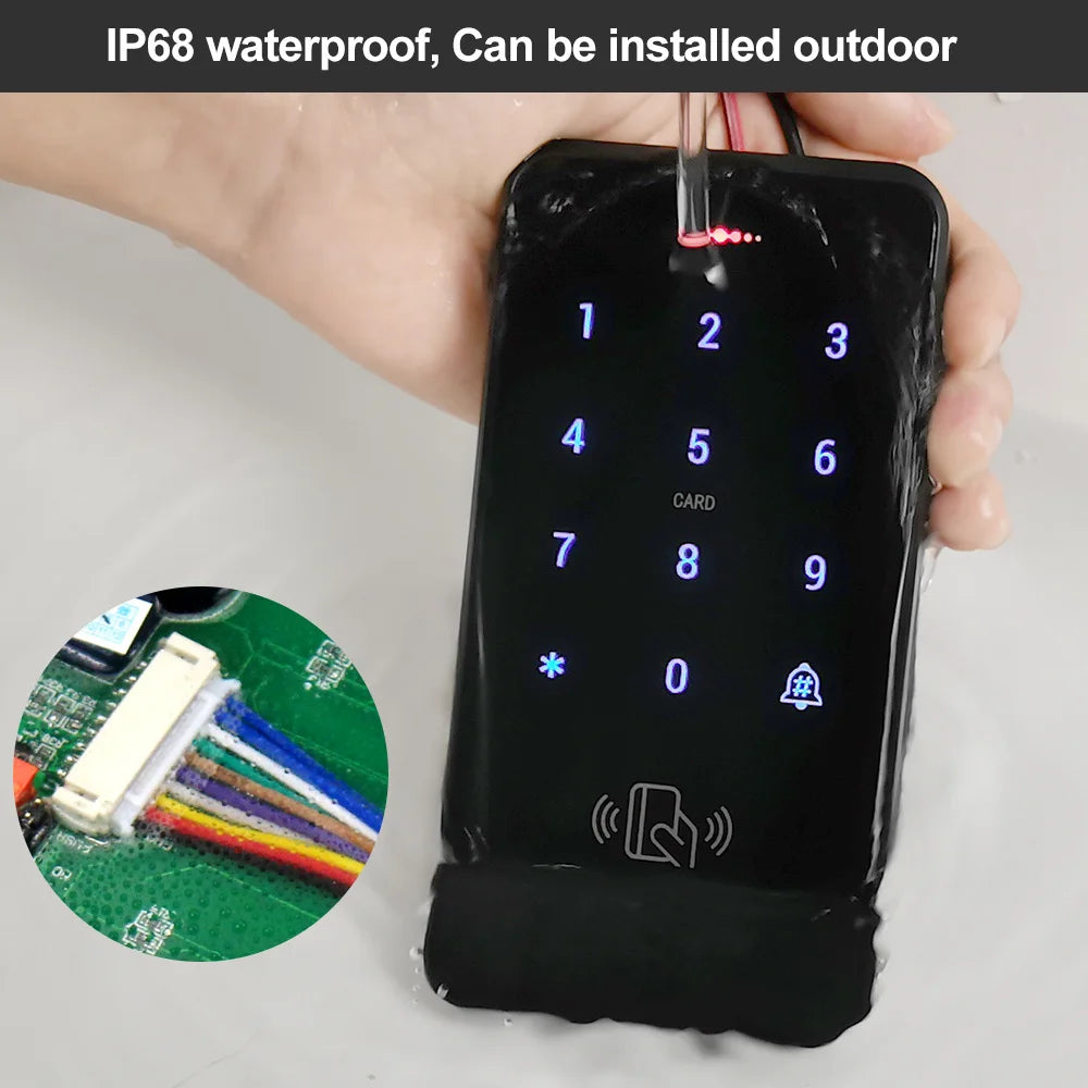 Black, waterproof keypad access controller with touch screen, LED numbers, and card reader under running water.
