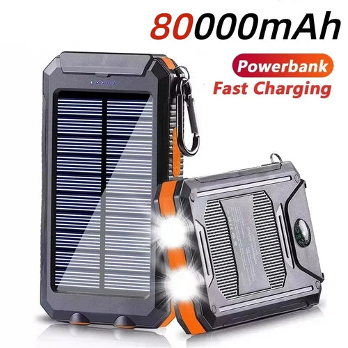 Black and orange rugged 80000mAh solar power bank with built-in LED torch, compass, and carabiner clip.