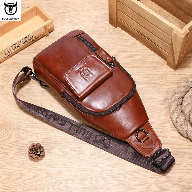 Brown leather men’s crossbody sling bag with multiple zip compartments and an adjustable webbing shoulder strap.