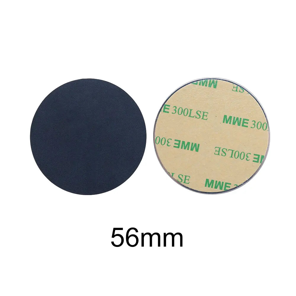 Two 56mm circular adhesive pads: one solid matte black, the other showing the tan paper backing with green text.