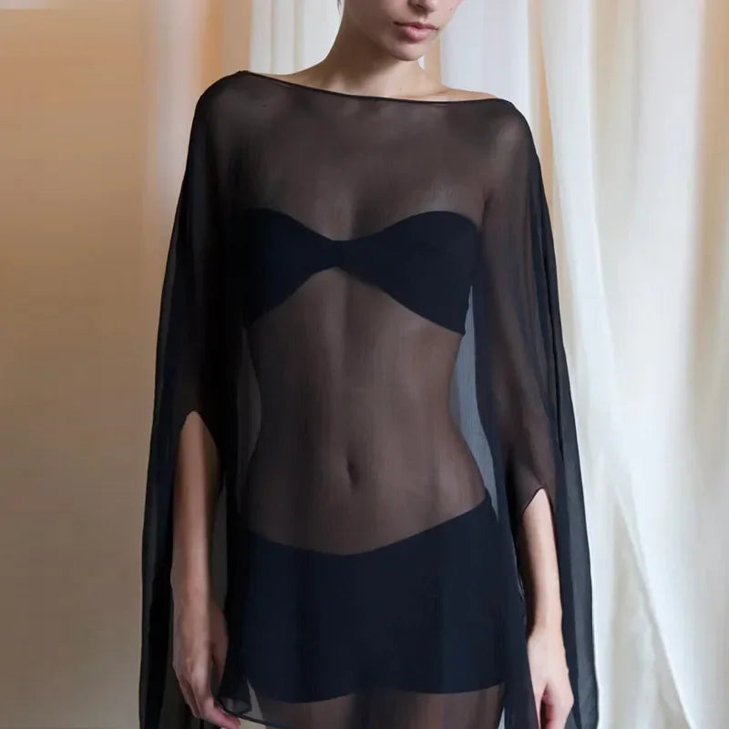 Sheer black kaftan-style cover-up with a wide boat neckline and flowing cape sleeves.