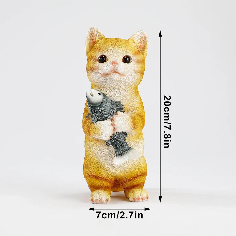 Charming ginger resin cat garden statue standing and holding a grey fish, showing dimensions of 20cm by 7cm.