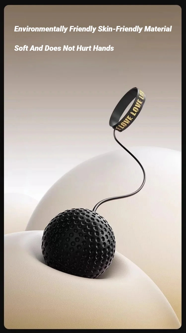 Black textured stress ball attached by a thin cord to a black wristband with the word 'LOVE' in gold lettering.