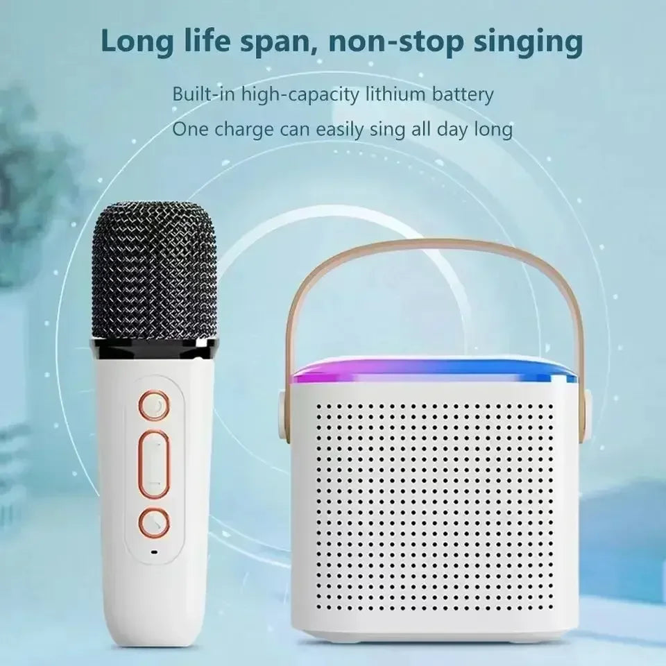 White portable Bluetooth karaoke speaker with carry handle, RGB lighting, and a matching handheld microphone.