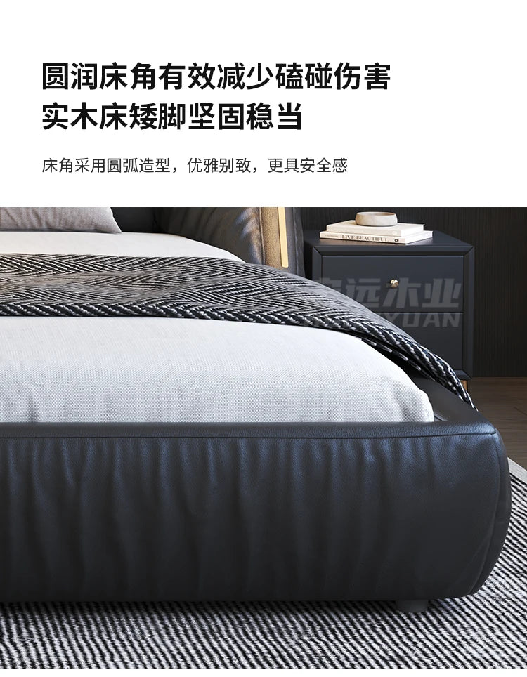 Modern charcoal grey upholstered king size bed frame with rounded corners and a low-profile, sleek design.
