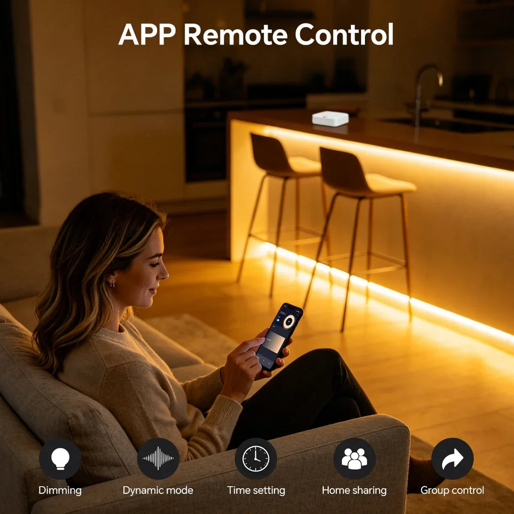 A woman on a sofa uses her smartphone to control warm-toned LED neon strip lights under a modern kitchen island.