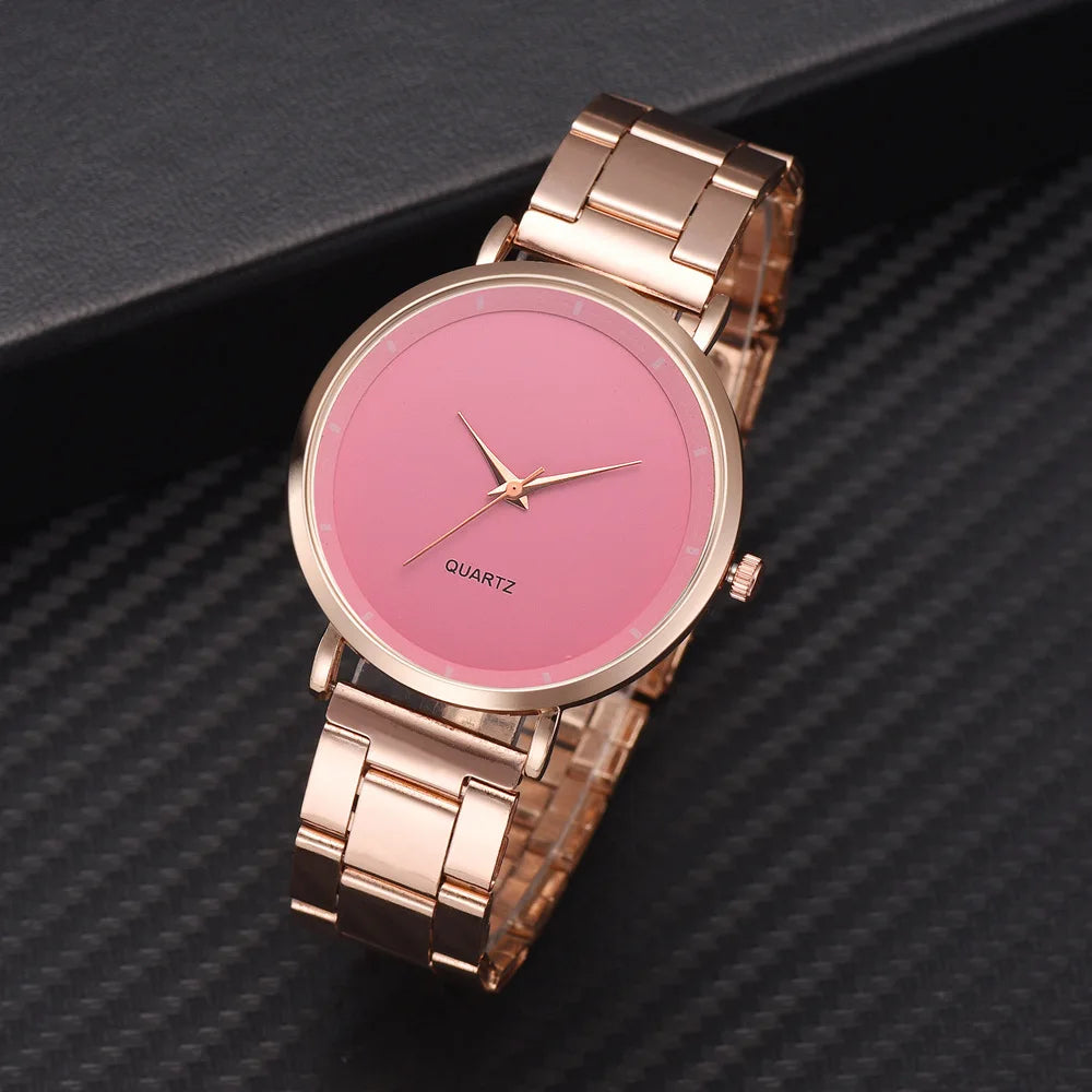 Ladies' rose gold stainless steel watch with a minimalist pink dial and simple analogue hands.