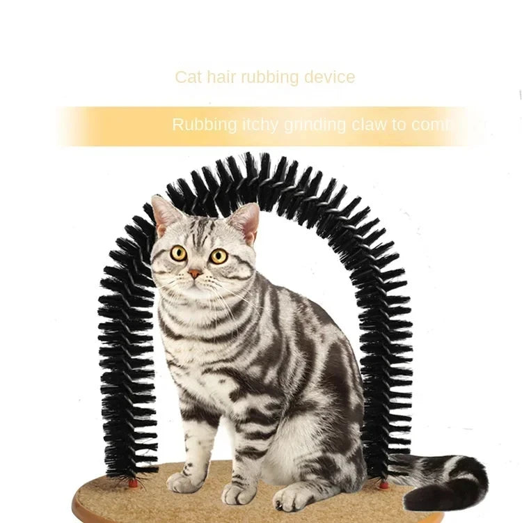 A tabby cat sits in front of a black bristled self-grooming arch mounted on a circular beige scratching pad base.