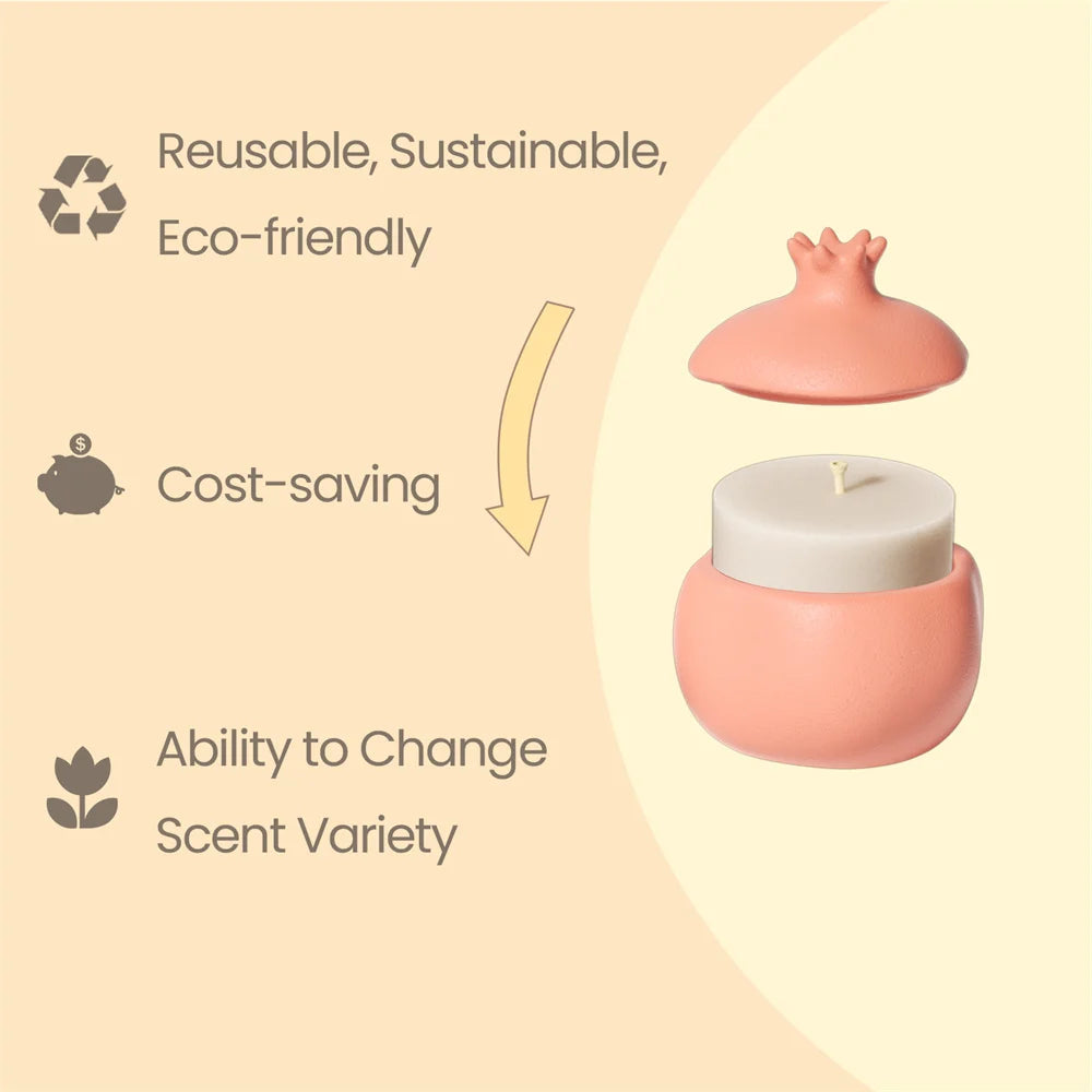 Pink pomegranate-shaped candle jar with a lid and a candle refill insert with a wick.