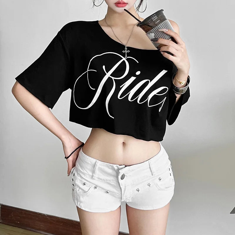 Black oversized crop t-shirt with short sleeves, skew collar, and white "Ride" letter print.