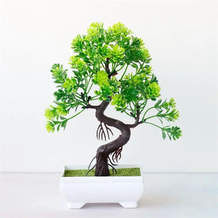 Artificial bonsai tree with vibrant green plastic foliage and a twisted dark trunk in a small, rectangular white pot.
