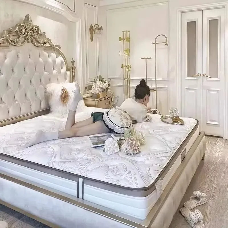 Elegant cream Italian-style double bed with a tall, ornate tufted headboard and matching upholstered frame.