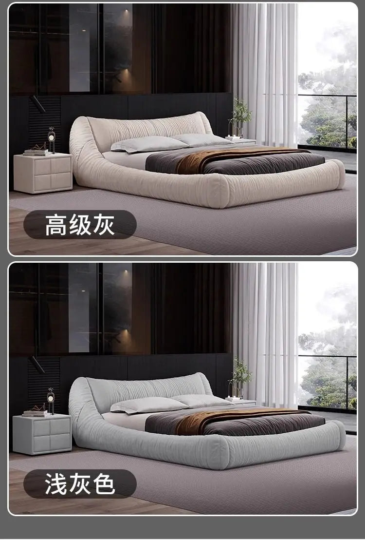 Modern low-profile bed frames in cream and light grey, featuring a curved, tufted design and matching bedside tables.
