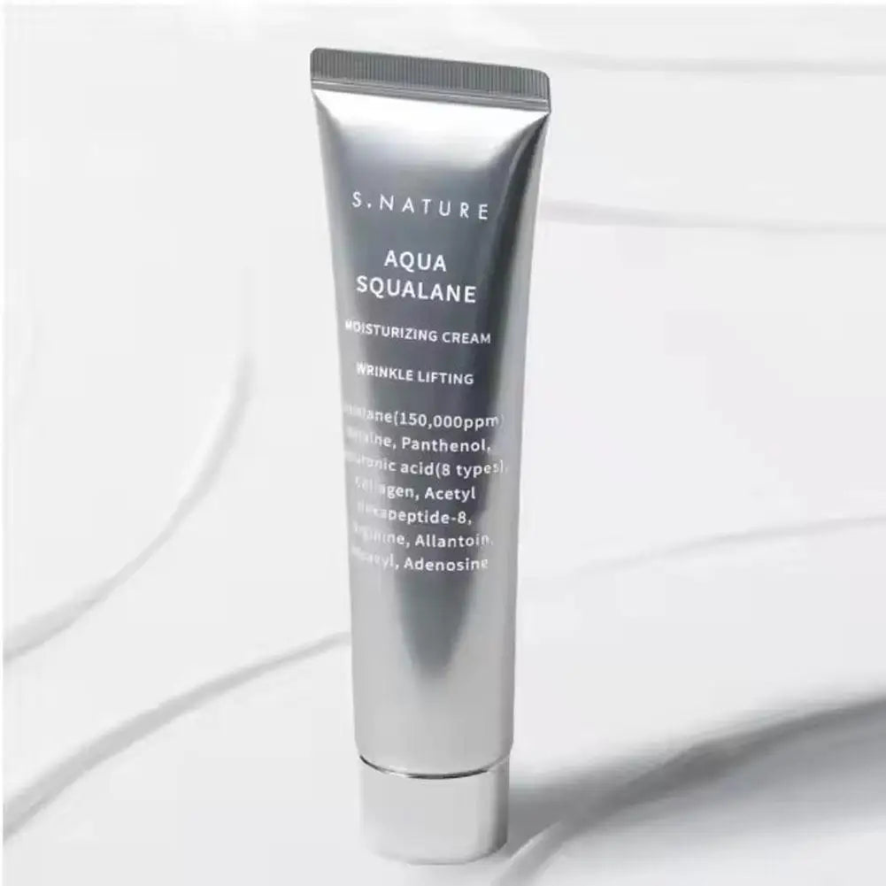 Silver squeeze tube of Aqua Squalane moisturizing face cream designed for wrinkle lifting and deep hydration.