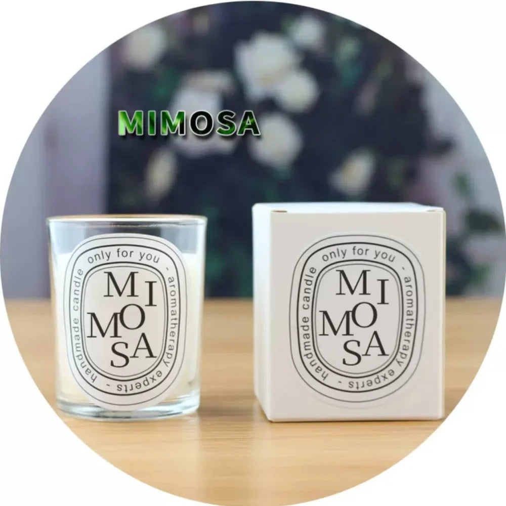Mimosa scented candle in a clear glass votive with a matching white presentation box, featuring a minimalist label.