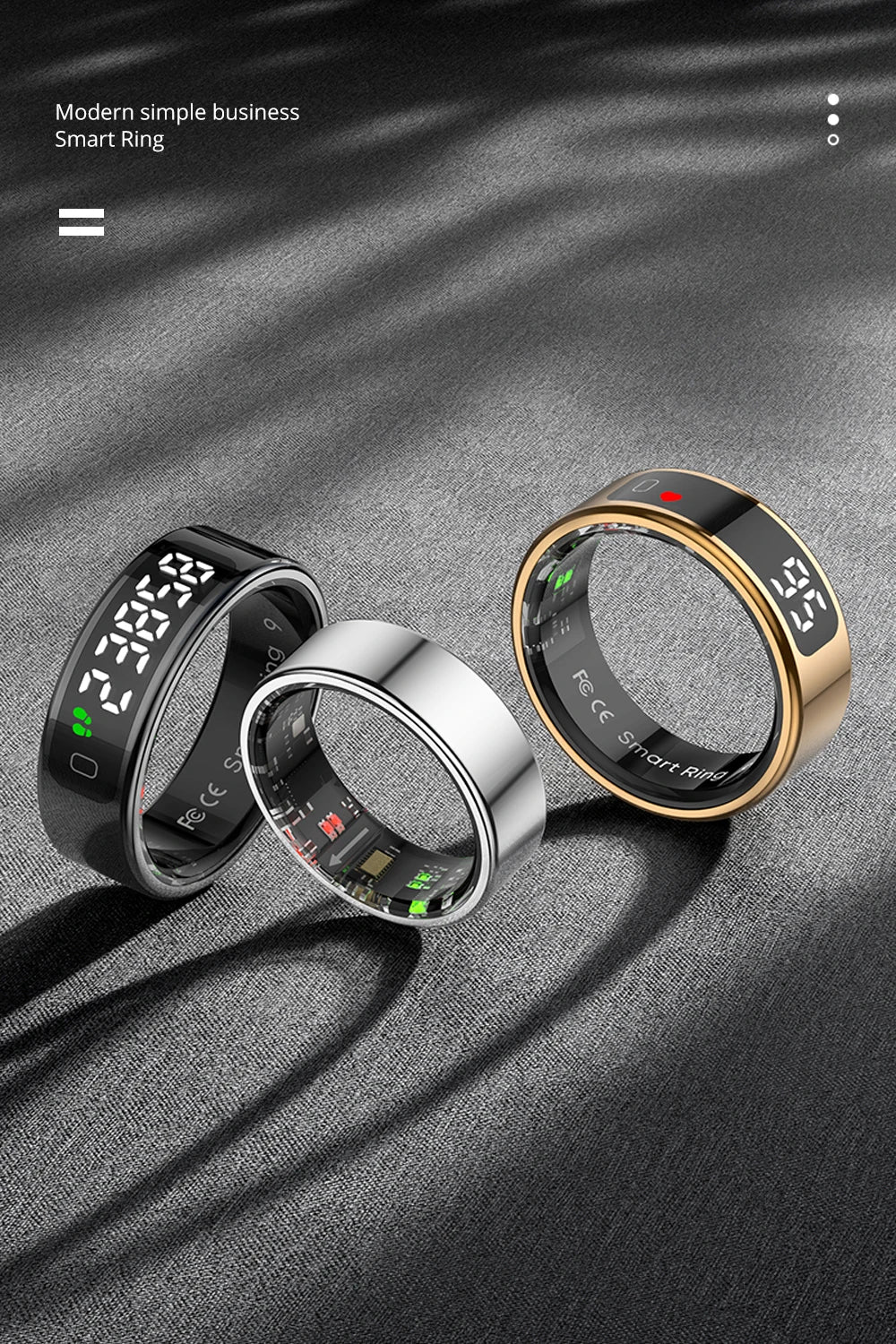 Three smart health-tracking rings in black, silver, and gold, each featuring a sleek, modern digital display.