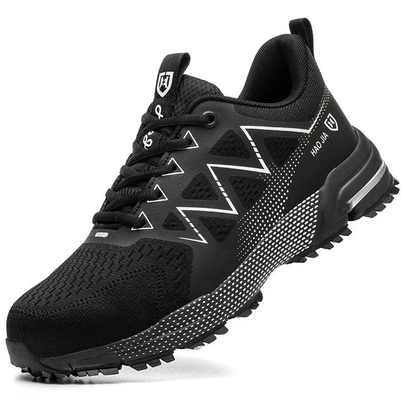 Black safety sneaker with steel toe, breathable mesh upper, lace-up front, and white zig-zag side pattern.
