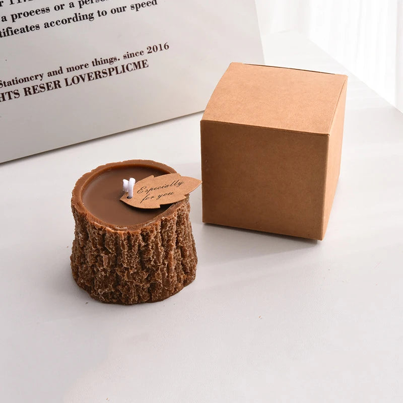 Brown tree stump-shaped wax candle with an "Especially for you" leaf tag, displayed with its kraft gift box.