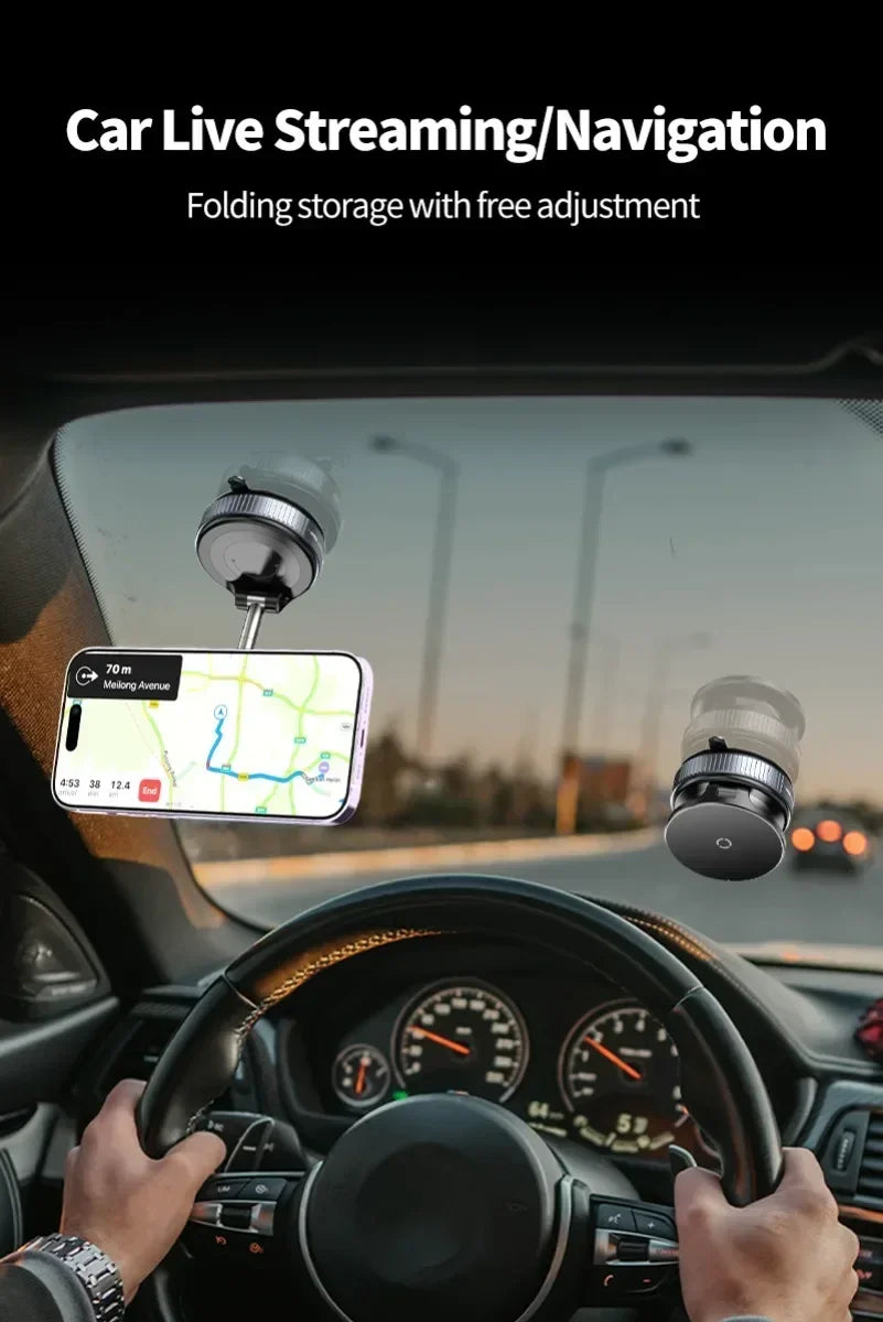 Black circular magnetic car phone mount for windshield, showing a mounted phone displaying a navigation map.