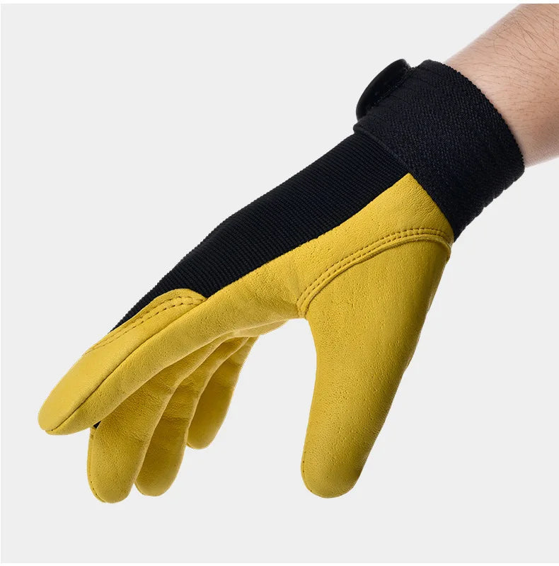 Yellow cowhide leather work glove with black fabric back and secure hook-and-loop wrist strap.