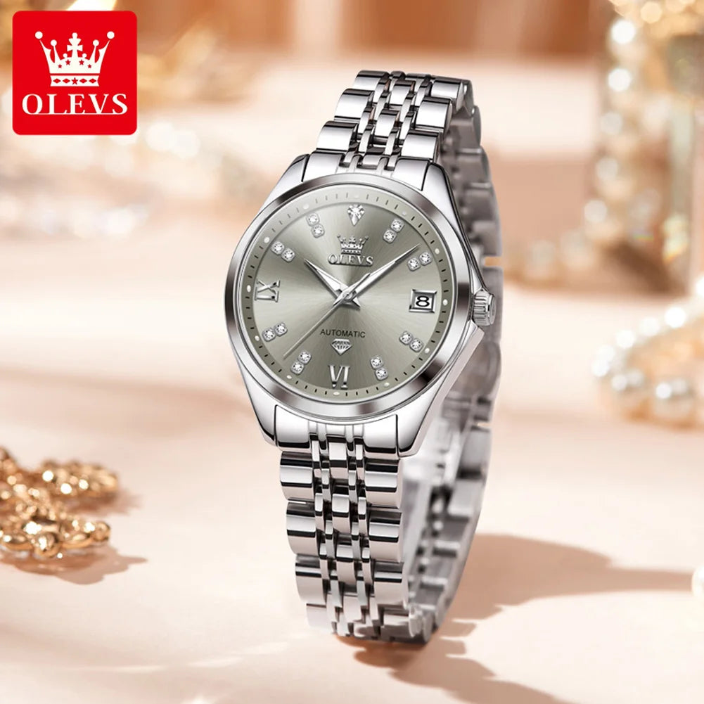 Elegant women’s silver-tone stainless steel automatic watch with a grey dial, crystal markers, and a date display.