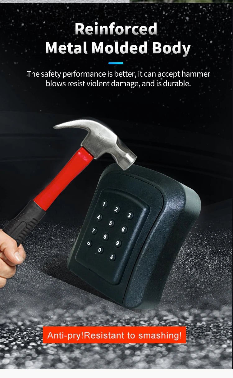 Black reinforced metal key lock box with a digital keypad being struck by a metal hammer.