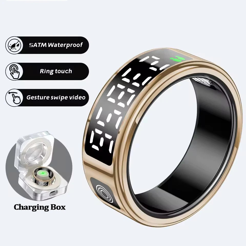 Gold smart health ring with a digital display, touch controls, waterproof design, and a dedicated charging case.