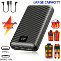 Black carbon fibre-style 30,000mAh power bank with LED status display, USB/DC ports, and heated clothing accessories.