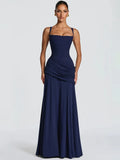 Navy blue sleeveless maxi dress with a square neckline, fitted bodice, draped hip detailing, and pleated skirt.
