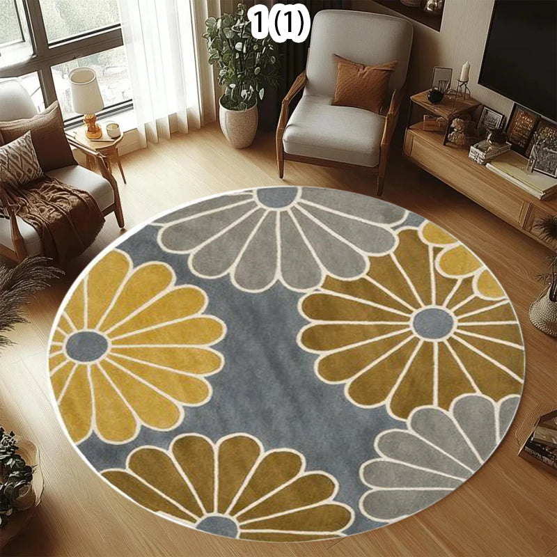 Round rug in a grey and mustard floral pattern with a modern, soft vintage style, placed in a living room.