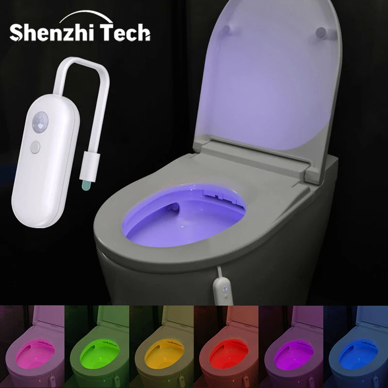 Rechargeable white motion-sensor toilet night light shown illuminating a toilet bowl in various vibrant LED colours.